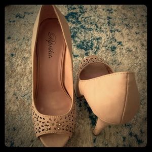 Soft pink platform heels with eylet details